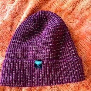 Woman’s winter hat never been one dark purple one-size-fits-all.